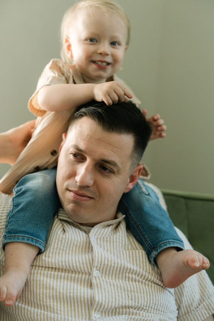 Father with big brother sitting on his shoulders