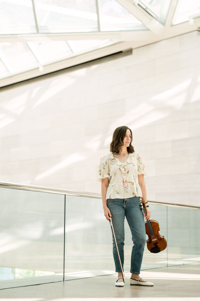 Freelance violinist Emily photographed in natural light at the National Gallery of Art
