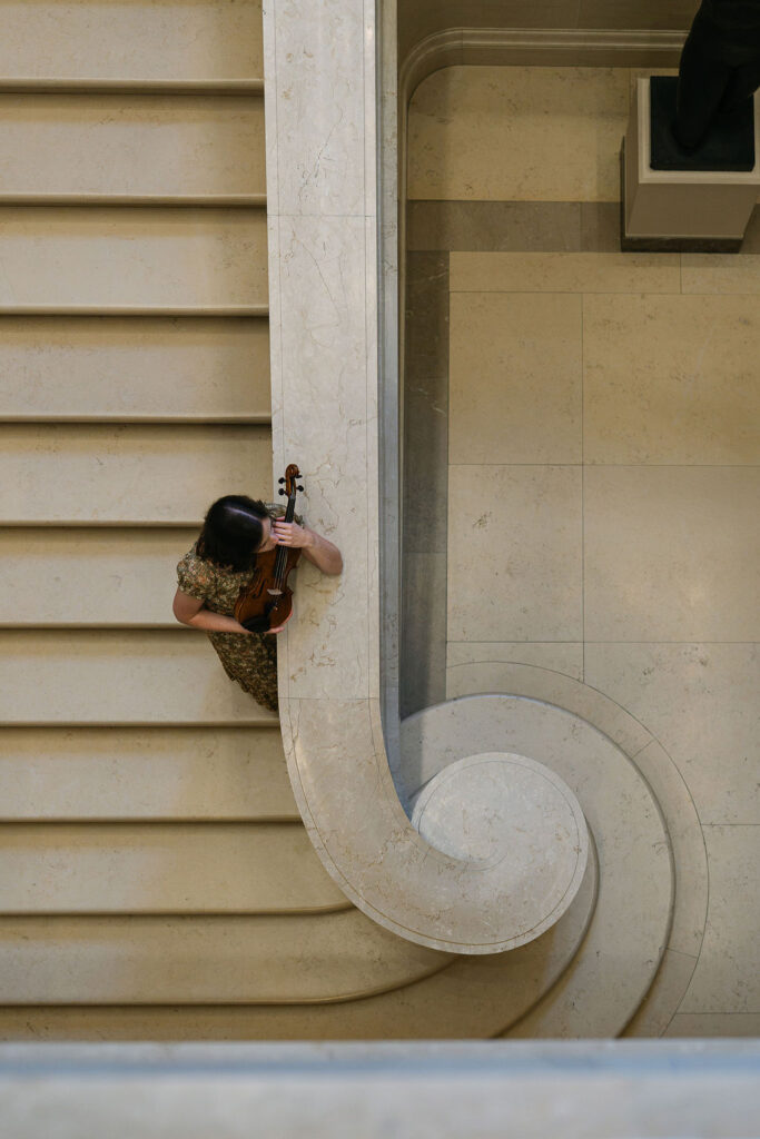 Washington, DC musician portrait featuring a violinist surrounded by beautiful museum architecture