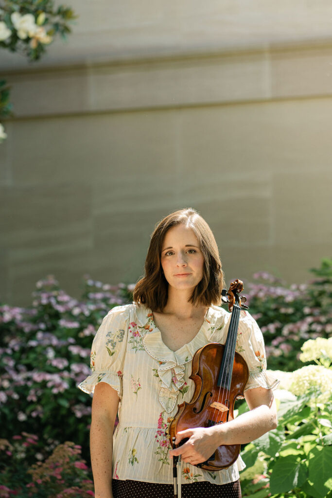 DC portrait photography featuring Emily with her violin outside the National Gallery of Art